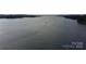 Aerial view of a boat traveling on the beautiful blue lake at 26056 Neptunes Lndg, Fort Mill, SC 29708