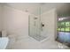 Newly remodeled bathroom features a sleek glass shower and commode at 26056 Neptunes Lndg, Fort Mill, SC 29708