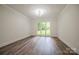 Spacious bedroom with large windows and modern flooring, offering a bright and airy atmosphere at 26056 Neptunes Lndg, Fort Mill, SC 29708