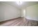 Light filled bedroom offers a light fixture and entrance to hallway at 26056 Neptunes Lndg, Fort Mill, SC 29708
