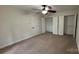 Carpeted bedroom with fan, closet, and natural light at 26056 Neptunes Lndg, Fort Mill, SC 29708