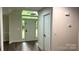 Bright entryway featuring a large arched window above the front door and sleek wood-look floors at 26056 Neptunes Lndg, Fort Mill, SC 29708
