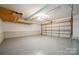 Spacious two car garage with epoxy floor, door opener, and painted walls at 26056 Neptunes Lndg, Fort Mill, SC 29708