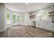 Bright eat-in kitchen features wood shelving, stainless steel appliances, and french doors to the exterior at 26056 Neptunes Lndg, Fort Mill, SC 29708