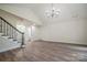 Inviting living room with hardwood floors and staircase at 26056 Neptunes Lndg, Fort Mill, SC 29708