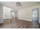 Spacious living room with hardwood floors, multiple doorways, and natural light at 26056 Neptunes Lndg, Fort Mill, SC 29708