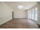 Bright living room with hardwood floors and a view of the outdoors through large windows at 26056 Neptunes Lndg, Fort Mill, SC 29708