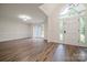 Bright living room with hardwood floors, large windows, and a welcoming entrance at 26056 Neptunes Lndg, Fort Mill, SC 29708