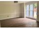 Inviting living room with large windows providing ample natural light and wood-look floors at 26056 Neptunes Lndg, Fort Mill, SC 29708