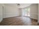 Bright living room with hardwood floors, natural light, and neutral colors at 26056 Neptunes Lndg, Fort Mill, SC 29708