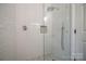 The glass walk-in shower features white subway tiles and geometric floor tiles at 26056 Neptunes Lndg, Fort Mill, SC 29708
