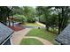 Serene view of a well-maintained yard surrounded by lush trees and foliage at 26056 Neptunes Lndg, Fort Mill, SC 29708