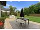 Backyard area with outdoor kitchen and dining space at 2913 Lake Ave, Charlotte, NC 28208