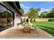Outdoor patio features stylish seating and dining area, perfect for entertaining and relaxing in the backyard at 2913 Lake Ave, Charlotte, NC 28208