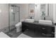 A modern bathroom featuring sleek fixtures and a walk-in shower at 2913 Lake Ave, Charlotte, NC 28208
