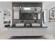 Spacious bathroom with double sinks, sleek vanity, and a large mirror with decorative pendant lights at 2913 Lake Ave, Charlotte, NC 28208