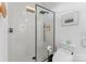 Sleek bathroom features a glass enclosed shower, white tile walls, and modern fixtures at 2913 Lake Ave, Charlotte, NC 28208