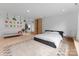 Spacious bedroom with hardwood floors, modern decor, and lots of natural light at 2913 Lake Ave, Charlotte, NC 28208