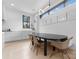 Well-lit dining area featuring a modern table, designer chairs, and an open layout with clean lines at 2913 Lake Ave, Charlotte, NC 28208