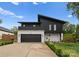 Striking modern home featuring a black and white exterior, clean lines, and well-manicured landscaping at 2913 Lake Ave, Charlotte, NC 28208
