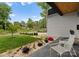 Inviting front porch area with modern seating, vibrant landscaping, and stylish stone accents at 2913 Lake Ave, Charlotte, NC 28208
