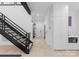 Bright hallway featuring open staircase, sleek cabinetry, and modern design at 2913 Lake Ave, Charlotte, NC 28208