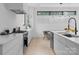 Bright modern kitchen with stainless steel appliances, marble counter tops, and pendant lighting at 2913 Lake Ave, Charlotte, NC 28208