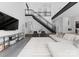 Expansive living area featuring a modern staircase, stylish decor, and an open-concept design for seamless living at 2913 Lake Ave, Charlotte, NC 28208