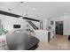 Open-concept living area showcasing modern design, with a kitchen island, sleek appliances, and contemporary lighting at 2913 Lake Ave, Charlotte, NC 28208