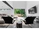 Bright living room with modern furnishings, large windows, and seamless flow to the outdoor space at 2913 Lake Ave, Charlotte, NC 28208
