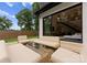 Outdoor patio with modern furniture and sliding doors to the interior at 2913 Lake Ave, Charlotte, NC 28208