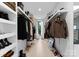 Spacious walk-in closet featuring custom shelving and a light wood floor at 2913 Lake Ave, Charlotte, NC 28208