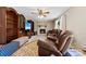 Cozy living room with a brick fireplace, comfortable seating, and built-in shelving for storage and display at 322 Killian Rd, Stanley, NC 28164