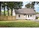Side view of home featuring a wood fence and grass lawn at 330 17Th Nw St, Hickory, NC 28601