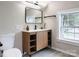 Bathroom vanity featuring a modern design with open shelving and a sleek rectangular mirror at 330 17Th Nw St, Hickory, NC 28601