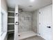 Bathroom features sleek black fixtures, a step-in shower, and neutral tile flooring at 330 17Th Nw St, Hickory, NC 28601