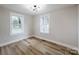 Well-lit bedroom offers ample natural light and hardwood floors for a clean, comfortable feel at 330 17Th Nw St, Hickory, NC 28601