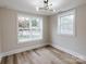 Well-lit bedroom features large windows and hardwood floors providing a cozy and comfortable ambiance at 330 17Th Nw St, Hickory, NC 28601