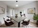 Bright, open dining room boasts a large table, stylish decor, and an airy atmosphere at 330 17Th Nw St, Hickory, NC 28601