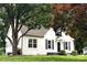 A cozy home with a white exterior, complemented by dark shutters and landscaping at 330 17Th Nw St, Hickory, NC 28601
