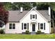 Home featuring a well-maintained lawn, crisp white exterior, black shutters and door at 330 17Th Nw St, Hickory, NC 28601