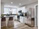 Well-lit kitchen featuring stainless steel appliances, white cabinetry, breakfast bar, and modern countertops at 330 17Th Nw St, Hickory, NC 28601