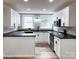 Well-lit kitchen featuring stainless steel appliances, white cabinetry, and modern countertops at 330 17Th Nw St, Hickory, NC 28601