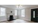 Bright, empty living room showcasing a fireplace, hardwood floors, and freshly painted walls at 330 17Th Nw St, Hickory, NC 28601