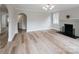 Empty living room with hardwood floors, a fireplace, and neutral paint at 330 17Th Nw St, Hickory, NC 28601