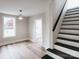 Sunlit living room with hardwood floors and staircase showcasing natural light and airy feel at 330 17Th Nw St, Hickory, NC 28601