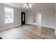 Spacious living room with hardwood floors, modern lighting, and ample natural light at 330 17Th Nw St, Hickory, NC 28601
