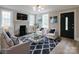 Elegant living room with fireplace, modern decor, and ample natural light at 330 17Th Nw St, Hickory, NC 28601