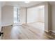 Open living room featuring luxury vinyl flooring with an open doorway to the bathroom at 330 17Th Nw St, Hickory, NC 28601