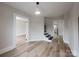 Bright living room with hardwood floors, staircase, and neutral paint color throughout the home at 330 17Th Nw St, Hickory, NC 28601
